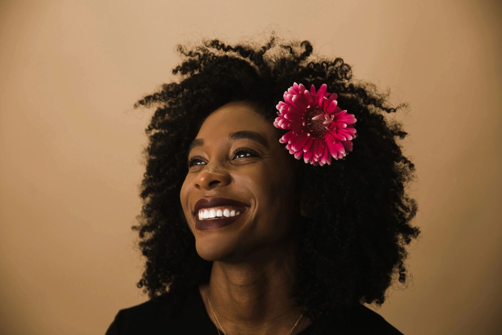 A woman with a flower in her hair.